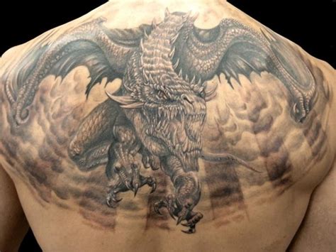 Big horrendous flying dragon tattoo on back - Tattoos Book - 65.000 ...