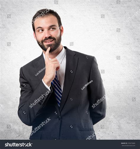 Business Man Thinking Over Textured Background Stock Photo 233675680