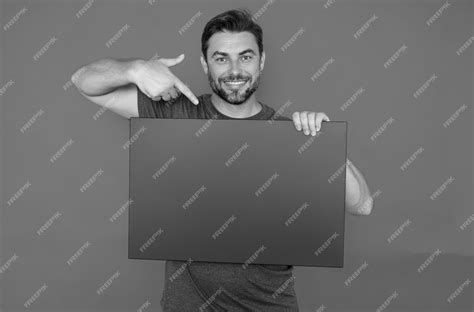 Premium Photo Man Holds Sign With Copy Space Placard Ready For Copy