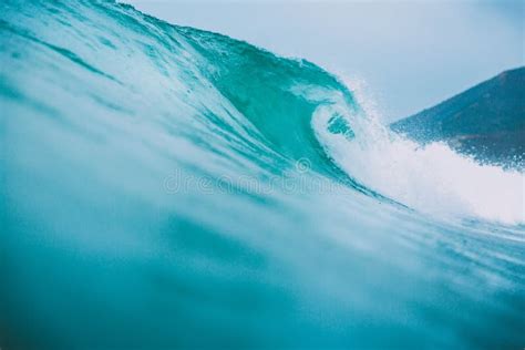 Blue Surfing Wave Breaks in the Ocean Stock Photo - Image of barrel ...