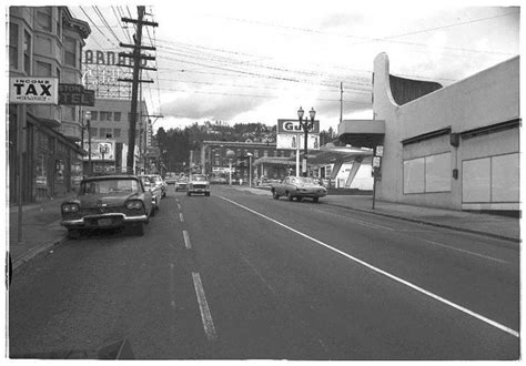 Black And White Photograph Of Cars Driving Down The Street