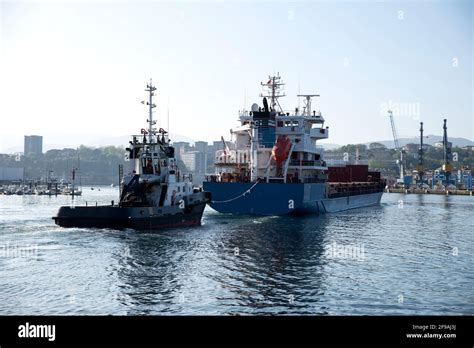 Cargo Ship Entering A Port Stock Photo Alamy