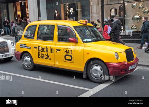 Bright Yellow London Taxi Advertising Hailo The Black Cab App Stock