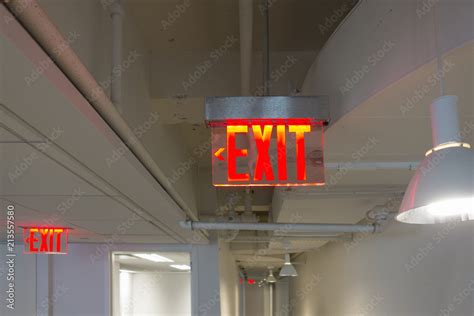 Modern exit sign red LED lights clear plexiglass Stock Photo | Adobe Stock