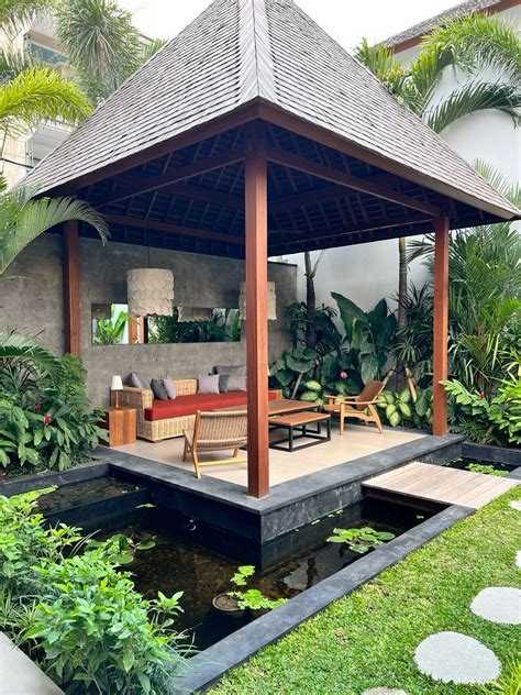 bali villa outdoor seating area  lush greenery gazebo bali