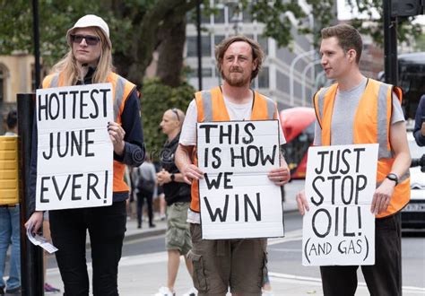 Just Stop Oil Activists Holding Protests Signs - London, UK. Editorial ...