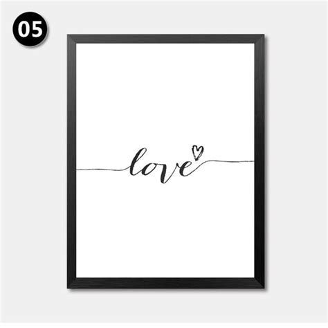 a black and white poster with the word love written in cursive writing ...