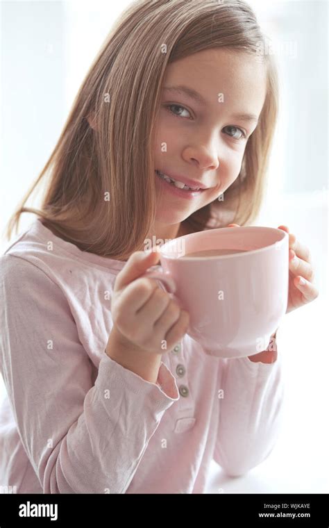 Years Old Girl Drinking Hot Cocoa From The Big Pink Cup Stock Photo Alamy