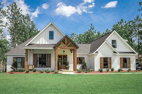 Farmhouse Plan With Open Concept Living And Beautiful Front Porch