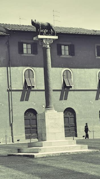 Premium Photo | Remus and romulus statue against building