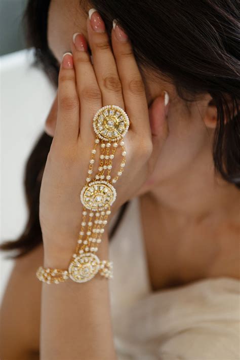 Buy Gold Plated Pearls Floweret Kundan And Embellished Haathphool By Do