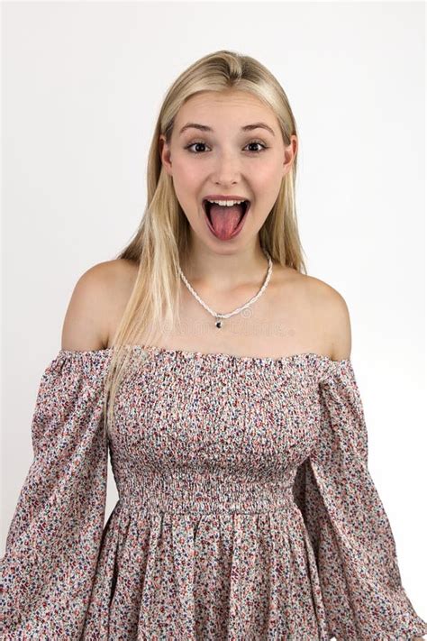 Photo Portrait Of A Funny Blonde Grimacing And Sticking Out Her Tongue Stock Image Image Of