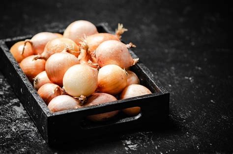 Premium Photo Fresh Onions On Rustic Background