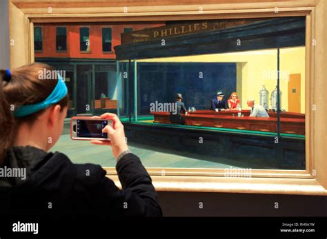 A visitor taking photos of Edward Hopper's painting Nighthawks (1942 ...