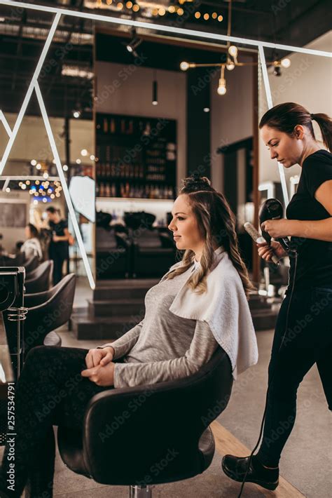 Beautiful Brunette Woman With Long Hair At The Beauty Salon Getting A Hair Blowing Hair Salon