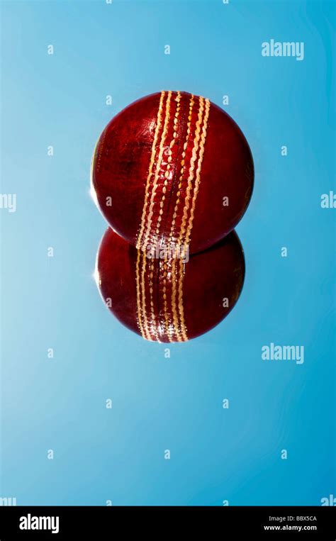 red cricket ball Stock Photo - Alamy