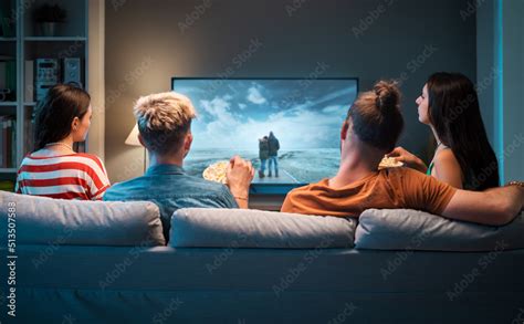 Friends Watching Movies Together At Home Stock Photo Adobe Stock