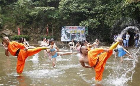 Bikini Lifeguards At China Rafting Attraction Train With Shaolin Monks