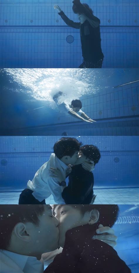 Two People Kissing Under Water In A Swimming Pool And Another Person