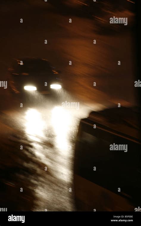 fast car driving in heavy rain at night in town Stock Photo - Alamy