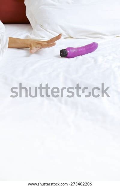 Womans Hand Reaching Dildo Bed Stock Photo 273402206 Shutterstock