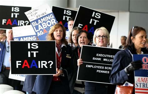 American Airlines workers protest job, pay cuts