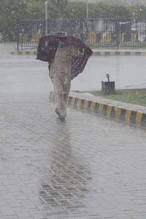 Pakistani Commuters Wade Through Flooded Road Editorial Stock Photo