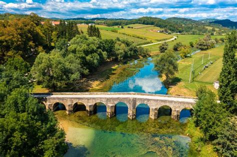 Aerial View Of The Old Stone Bridge On The Dobra River Stock Image