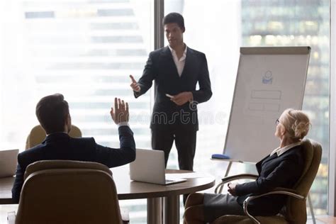 Businessman Raising Hand At Corporate Training Ask Questions African