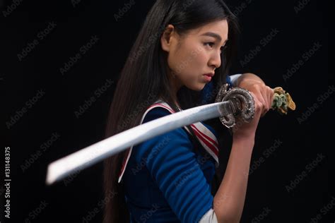 Pretty Brunette Lady With Red Lips Looking Like Warrior Asian Lady Posing Sword For