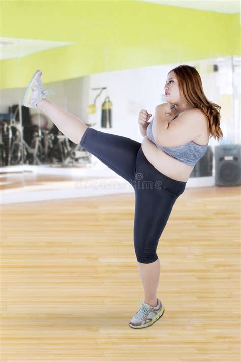 Fat Woman With A Kicking Pose At Gym Stock Image Image Of Concept Blonde