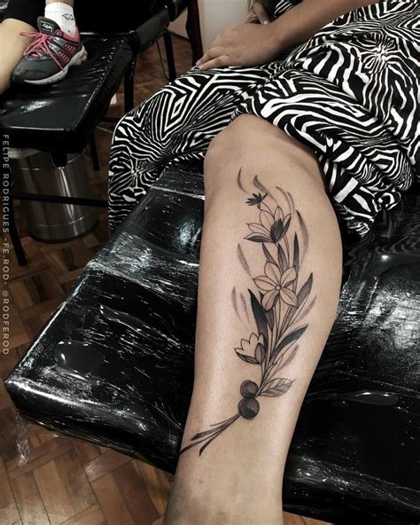 A Woman S Leg With Flowers And Leaves Tattoo On Her Left Side Calfocks