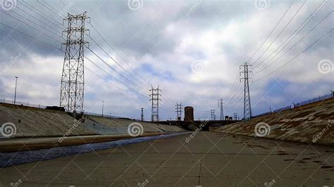 The Los Angeles River With Bridge And Blue Sky In The Background Stock