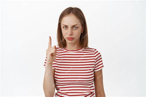 Free Photo Upset Blond Girl Pointing Finger Up Frowning Displeased Dislike Smth Express Her