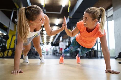 Portrait Of Happy Fit People Friends Exercising In Gym Together Sport