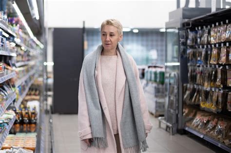 Premium Photo Elderly Pretty Adult Stylish Blonde Woman Smiling At Grocery Store Shopping For