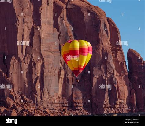 A Hot Air Balloon Flying In The Monument Valley Balloon Festival In The