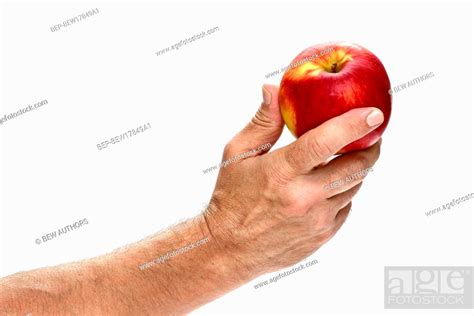 Male Hand Holding Apple Isolated On White Background Stock Photo