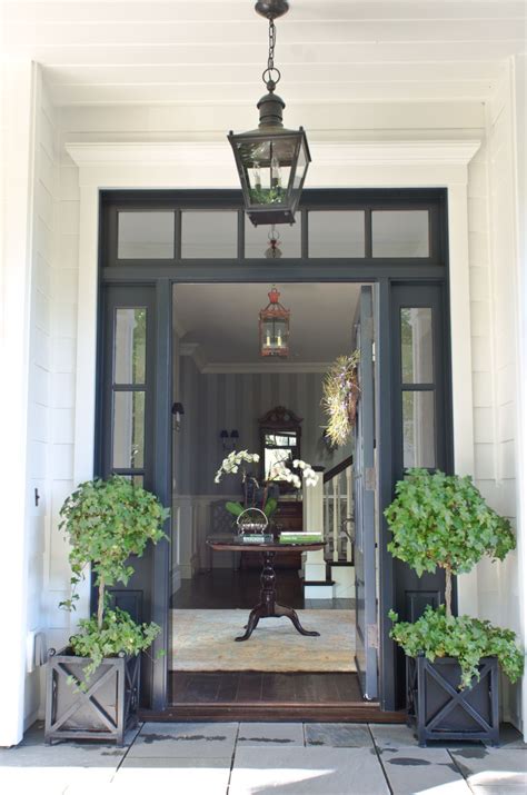 Beautiful Front Door Entryway With Symmetrical Glass Paneling And Plants Matt O Dorisio Design