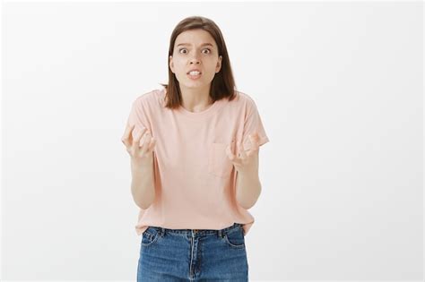 Free Photo Pissed Off Angry Woman Clenching Hands And Looking Mad At