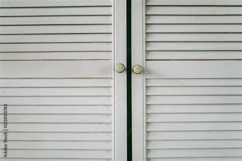 Fluted white wooden cupboard doors in the kitchen close-up Stock Photo ...