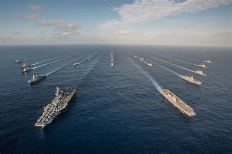 The US Navy's Ronald Reagan Carrier Strike Group in formation with Japanese Maritime Defense ...