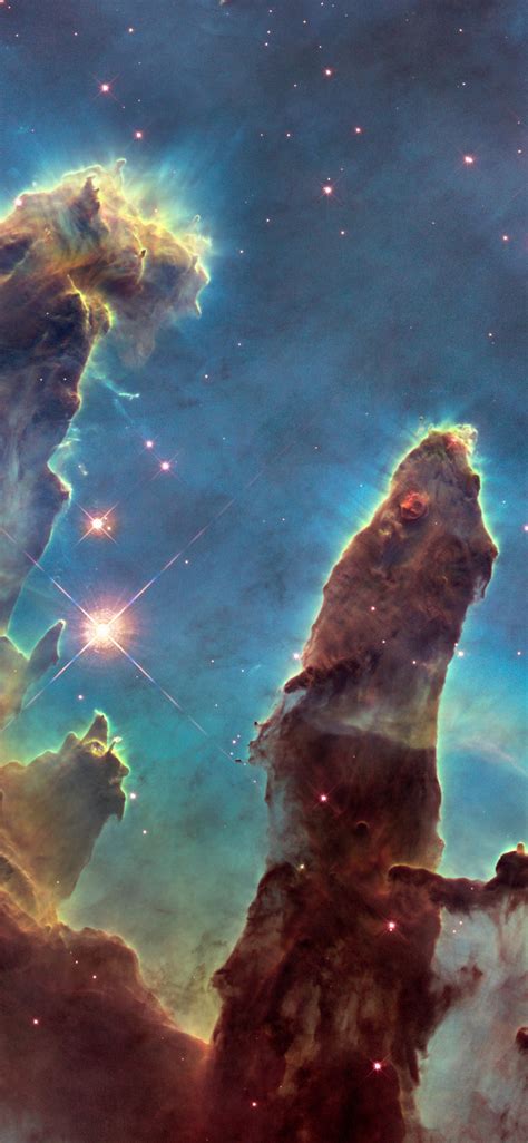 Download wallpaper: The Eagle Nebula's Pillars of Creation 1125x2436