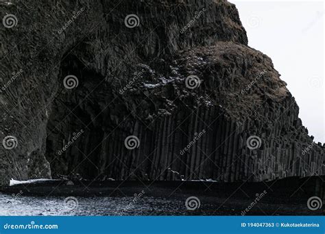 Rock of Basalt Pillars on a Black Beach in Iceland Stock Image - Image ...