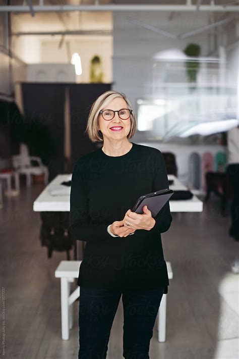 Mature Store Owner Woman Portrait In Clothing Shop By Stocksy