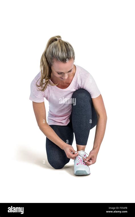 Sporty Woman Tying Shoelace Stock Photo Alamy