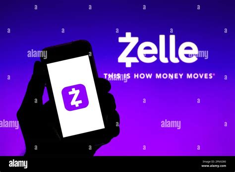 In this photo illustration a Zelle app seen displayed on a smartphone with the Zelle logo in the ...