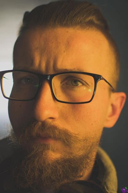 Premium Photo Close Up Portrait Of Man Wearing Eyeglasses