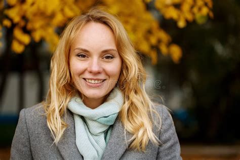 Headshot Of Pretty Smiling Blonde Woman In Auatmn Park Stock Image