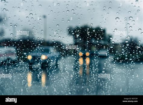 Cars Driving Through Heavy Rain Raindrops On The Windshield Stock